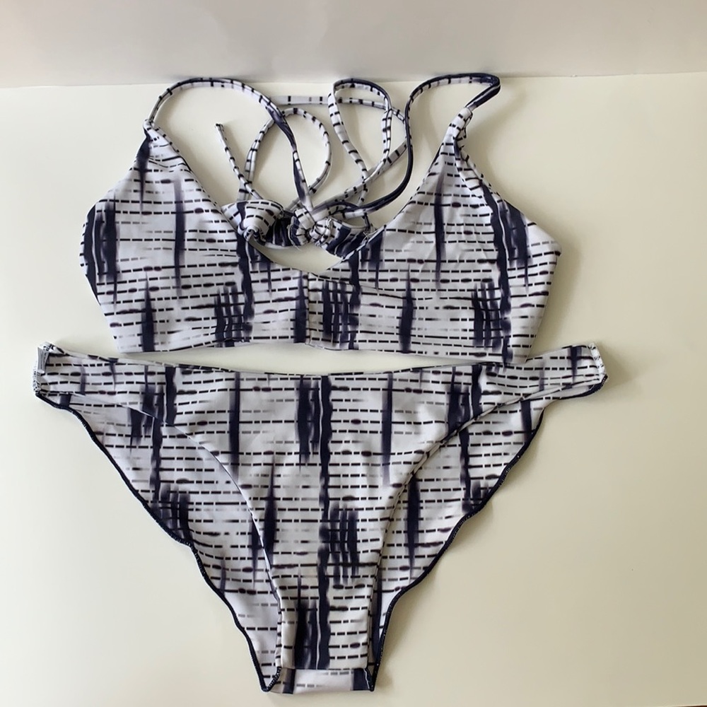 White and purple two-piece bikini set.